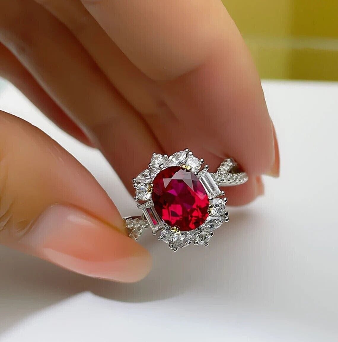 Side view of the oval-cut ruby engagement ring, highlighting the detailed craftsmanship