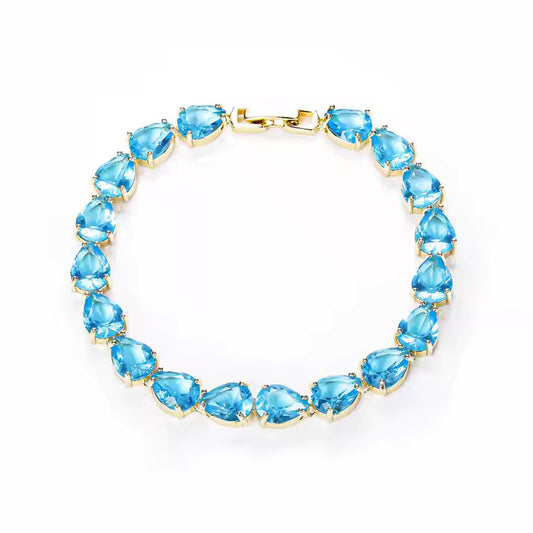 Pear Cut Blue Topaz Tennis Bracelet – Timeless Luxury with a Pop of Color