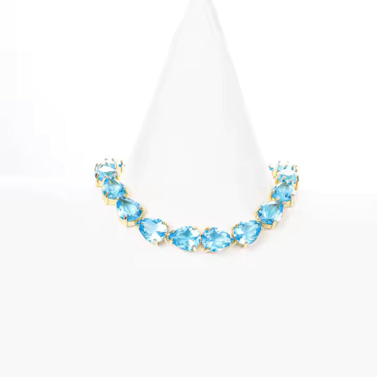 Pear Cut Blue Topaz Tennis Bracelet – Timeless Luxury with a Pop of Color